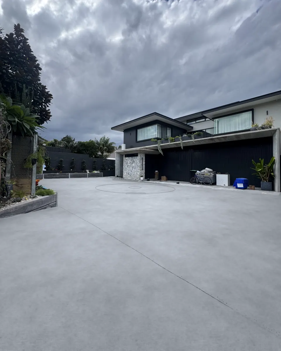 Before: the driveway as plain grey concrete